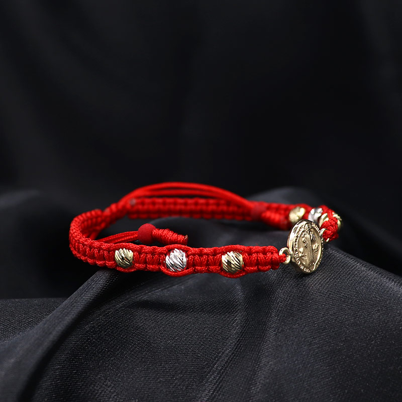 Pulsera artesanal con herraje de San Benito.